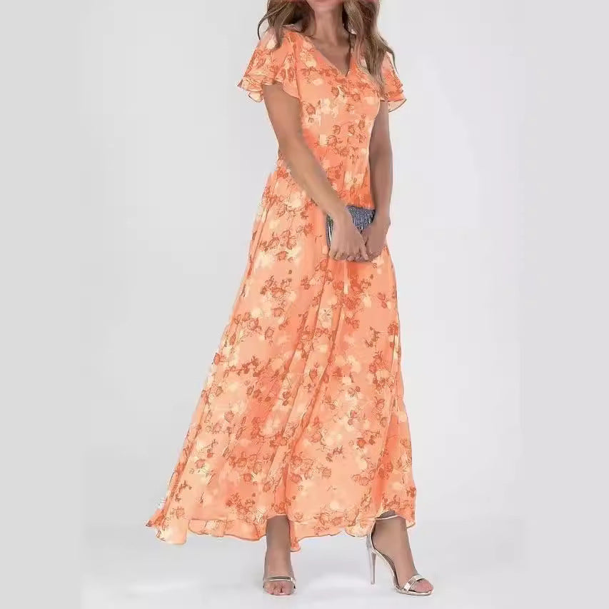 Vestido largo de gasa naranja con estampado floral, escote en V y volantes elegantes para verano.