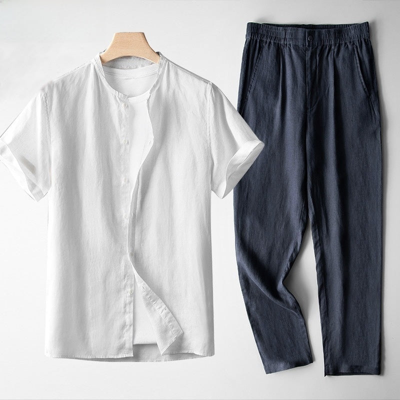 Conjunto de lino para hombre: camisa blanca estilo Tang y pantalón azul marino transpirable de corte casual.
