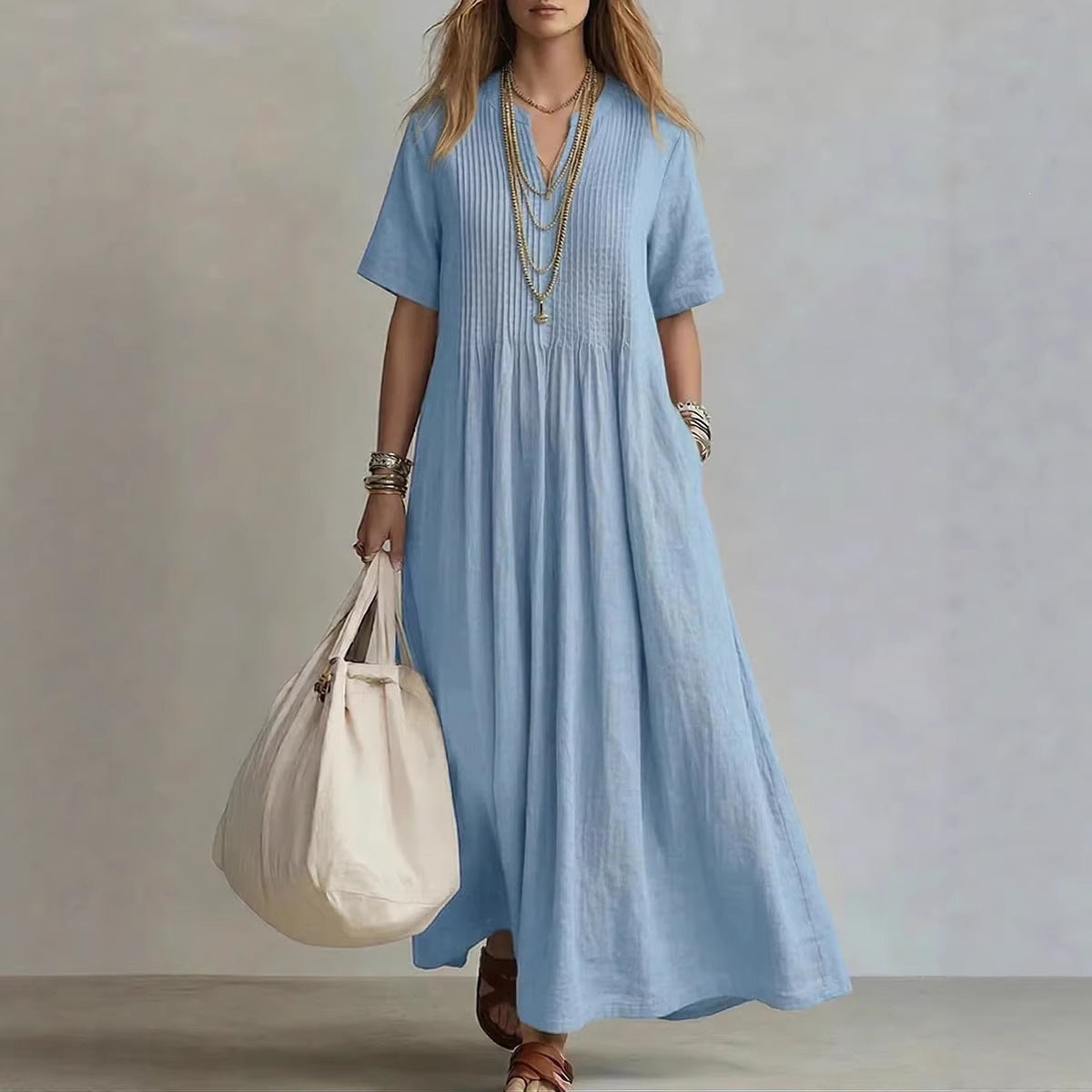 Vestido largo de algodón y lino azul claro ZYVA con cuello en V, plisado frontal y manga corta para mujer.