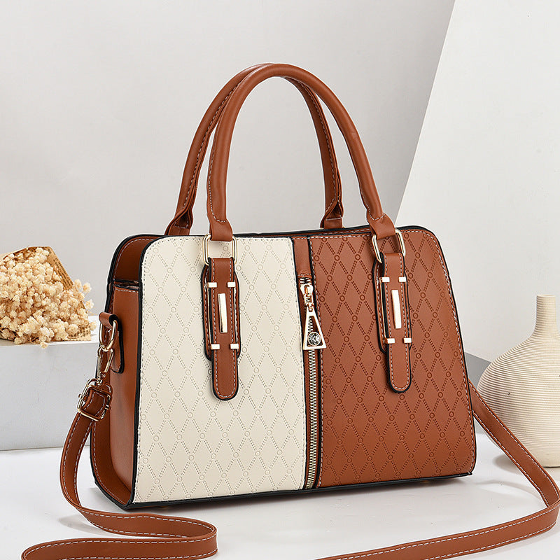 Bolso tote grande para mujer en diseño color-block blanco y marrón con grabado geométrico y doble asa de mano.